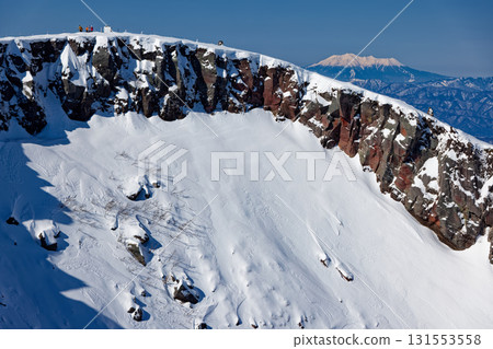 The crater wall of Mount Iodake and Mount Ontake in the Yatsugatake mountain range in winter The crater wall of Mount Iodake and Mount Ontake in the Yatsugatake mountain range in winter 131553558