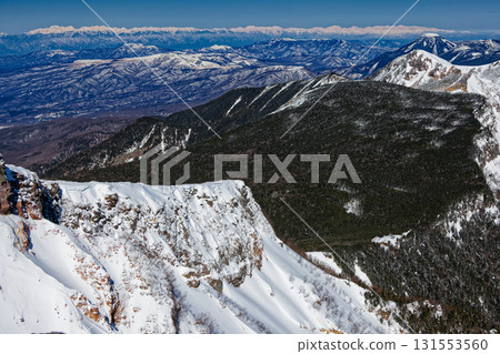 View of Mount Tengu, Mount Tateshina and the Northern Alps from the summit of Mount Iodake in the Yatsugatake Mountain Range in winter 131553560