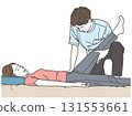 Male chiropractor massaging a female patient's leg 131553661