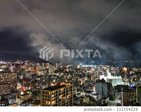 Aerial view of Kagoshima city after the fireworks display, leaving behind smoke 131554229