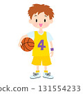 A boy wearing a yellow uniform holding a basketball 131554233