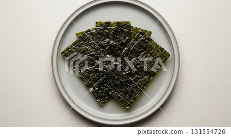 Roasted Seaweed Sheets Arranged on Ceramic Plate Roasted Seaweed Sheets Arranged on Ceramic Plate 131554726