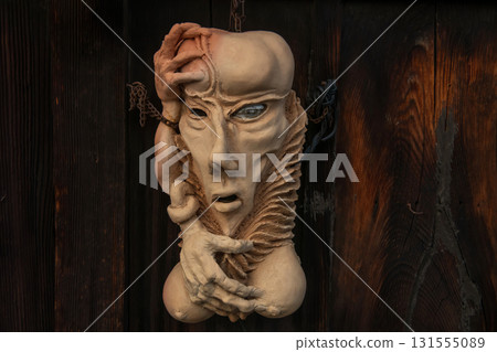 Human clay sculpture artwork hang on wall at Higashiyama, Kyoto 131555089