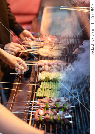 Close-up of delicious food at the night market barbecue stall Close-up of delicious food at the night market barbecue stall 131555949
