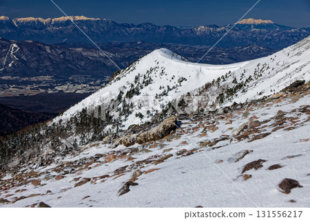 Akaiwanoto and Mt. Ontake in the Central Alps seen from the ridge of Mt. Iodake in the Yatsugatake Mountain Range in winter Akaiwanoto and Mt. Ontake in the Central Alps seen from the ridge of Mt. Iodake in the Yatsugatake Mountain Range in winter 131556217