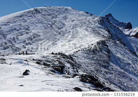 The main peak of Yokodake in the Yatsugatake mountain range in winter, seen from near Iodake Sanso The main peak of Yokodake in the Yatsugatake mountain range in winter, seen from near Iodake Sanso 131556219