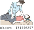Male chiropractor giving a massage to a female patient 131556257
