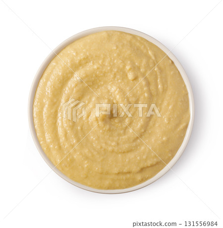 Creamy hummus rotating in a white bowl: top view Creamy hummus rotating in a white bowl: top view 131556984