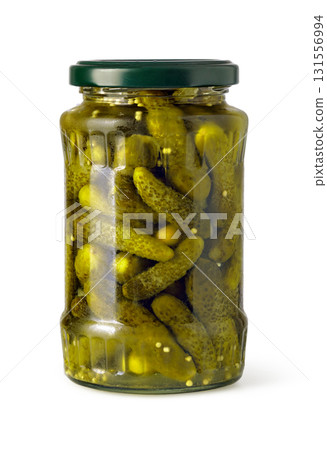 Glass jar filled with gherkins preserved in vinegar on white background 131556994