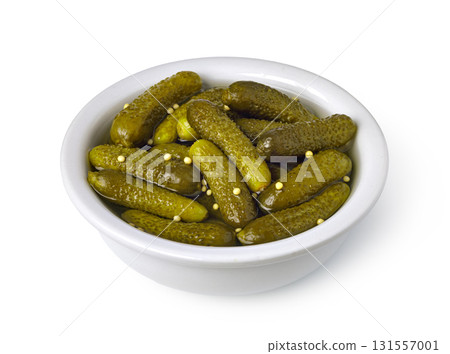 Bowl overflowing with delicious, pickled gherkins and mustard seeds Bowl overflowing with delicious, pickled gherkins and mustard seeds 131557001