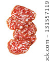 Salami slices stacked on white background 131557119