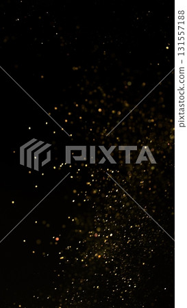 Freeze Motion Shot of Golden Glitter Background Isolated on Black 131557188