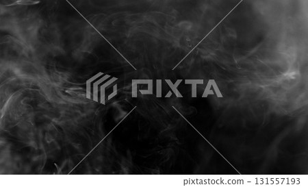 Detail Shot of Atmospheric Smoke Slowly Floating on Black Background Detail Shot of Atmospheric Smoke Slowly Floating on Black Background 131557193