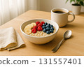 Healthy oatmeal bowl with fruit and coffee 131557401
