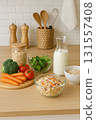 Fresh vegetables, grains and milk in kitchen 131557408