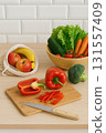 Fresh vegetables and fruits on kitchen table 131557409