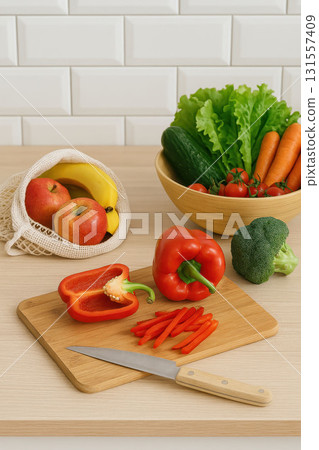 Fresh vegetables and fruits on kitchen table Fresh vegetables and fruits on kitchen table 131557409
