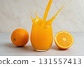Fresh Orange Juice Splash in Glass 131557413