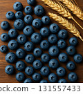 Fresh blueberries with wheat ears on wooden table 131557433