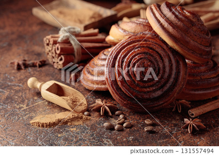 Freshly baked sweet cinnamon buns. Freshly baked sweet cinnamon buns. 131557494