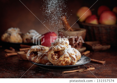 Homemade mini apple strudels with apples and cinnamon. Homemade mini apple strudels with apples and cinnamon. 131557574