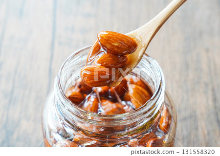 Honeyed almonds in a spoonful jar Honeyed almonds in a spoonful jar 131558320