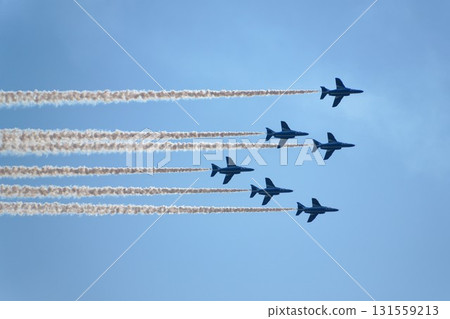 Blue Impulse flying in the blue sky Blue Impulse flying in the blue sky 131559213