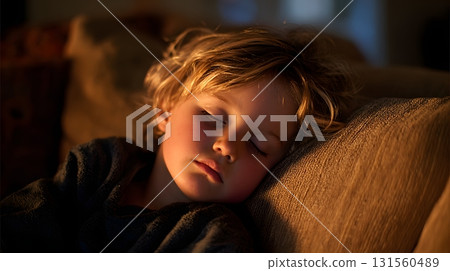 Child falling asleep on sofa, dim light, peaceful modern home 131560489