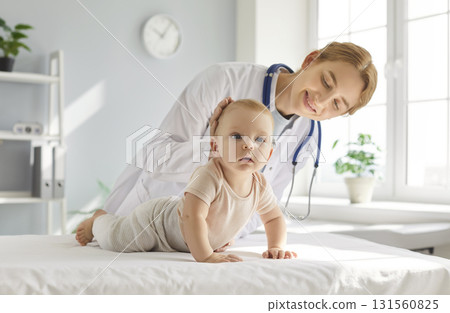 Cute healthy little baby child getting medical check up at pediatrician's office Cute healthy little baby child getting medical check up at pediatrician's office 131560825