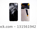 broken smartphone touchscreen, front and back view, on white background, smartphone repair concept 131561942