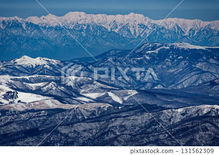 View of the Tsurugi and Tateyama mountain ranges from Yokodake in the Yatsugatake mountain range in winter 131562309