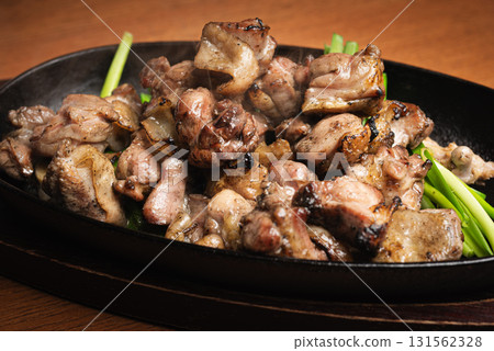 Grilled local chicken on a hot plate 131562328