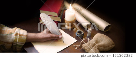Man writing a letter on a desk 131562382