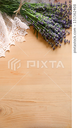 Lavender flowers lie on the table on lace Lavender flowers lie on the table on lace 131562408