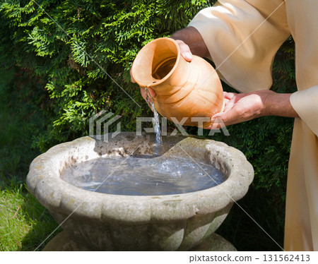 Hands pour water into the pot Hands pour water into the pot 131562413