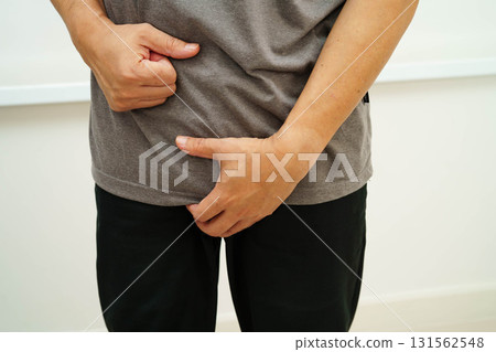 Hernia, Asian man stomach ache, abdominal pain and urology problem health. 131562548