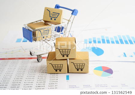 Online shopping, Shopping cart box on business graph, import export, finance commerce. Online shopping, Shopping cart box on business graph, import export, finance commerce. 131562549