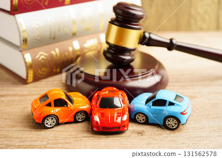 Bangkok, Thailand March 15, 2023 Car accident lawsuit and insurance, Judge hammer with car model. Bangkok, Thailand March 15, 2023 Car accident lawsuit and insurance, Judge hammer with car model. 131562578