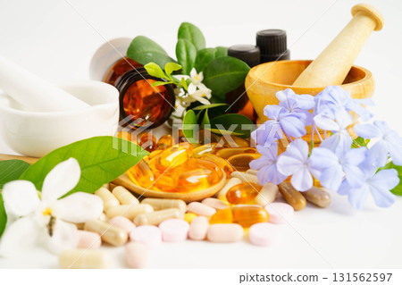 Alternative medicine herbal organic capsule with vitamin E omega 3 fish oil, mineral, drug with herbs leaf natural supplements for healthy good life. 131562597