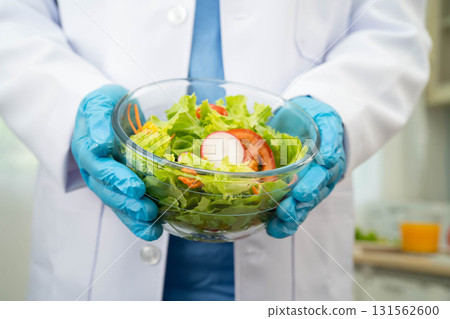 Asian Nutritionist holding healthy food for patient in hospital, nutrition and vitamin. Asian Nutritionist holding healthy food for patient in hospital, nutrition and vitamin. 131562600
