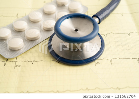 Stethoscope on electrocardiogram ECG with drug, heart wave, heart attack, cardiogram report. 131562704
