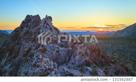 Aerial Golden Hour Desert Landscape With Rugged Sandstone Formations And Sunset 131562987