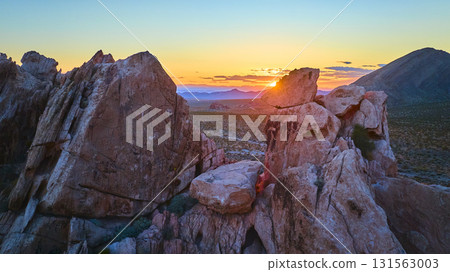 Aerial Dramatic Rock Formations and Desert Landscape at Sunset Golden Hour 131563003