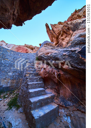 Stone Steps Leading Up Through Red Rock Formations in Desert Canyon Stone Steps Leading Up Through Red Rock Formations in Desert Canyon 131563031