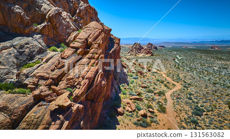 Aerial Red Rock Cliffs and Desert Trail in Gold Butte National Monument 131563082