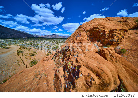 Red Sandstone Formations and Desert Landscape under Blue Sky 131563088