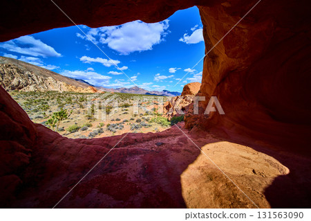 Whitney Pocket Arch Formation Framing Mojave Desert Landscape Under Blue Sky Whitney Pocket Arch Formation Framing Mojave Desert Landscape Under Blue Sky 131563090