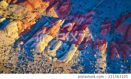 Aerial Golden Hour Sandstone Formations and Desert Terrain Top Down 131563105