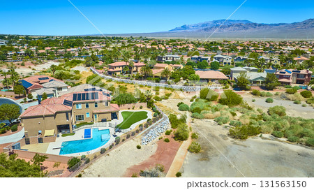 Aerial Residential Neighborhood With Pool Homes and Desert Landscape in Las Vegas Aerial Residential Neighborhood With Pool Homes and Desert Landscape in Las Vegas 131563150