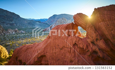 Aerial Red Rock Arch Sun Flare Desert Landscape Golden Hour Aerial Red Rock Arch Sun Flare Desert Landscape Golden Hour 131563152